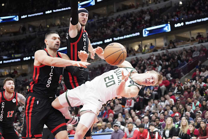 Chicago Bulls center Nikola Vucevic (9) flagrantly fouls Milwaukee Bucks guard AJ Green (20) 